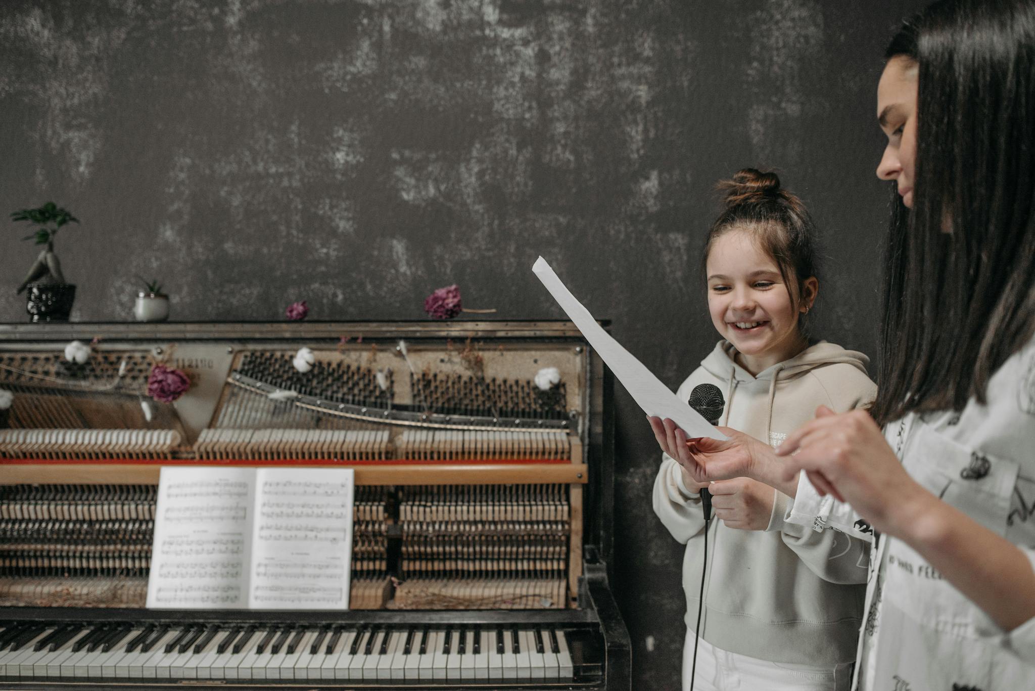 A young girl learning piano with a teacher in a cozy, vintage-styled room.